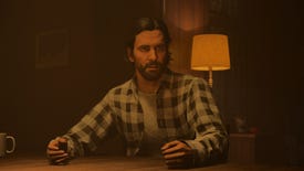 A confused Alan Wake sits at a table in an Alan Wake 2 cutscene.